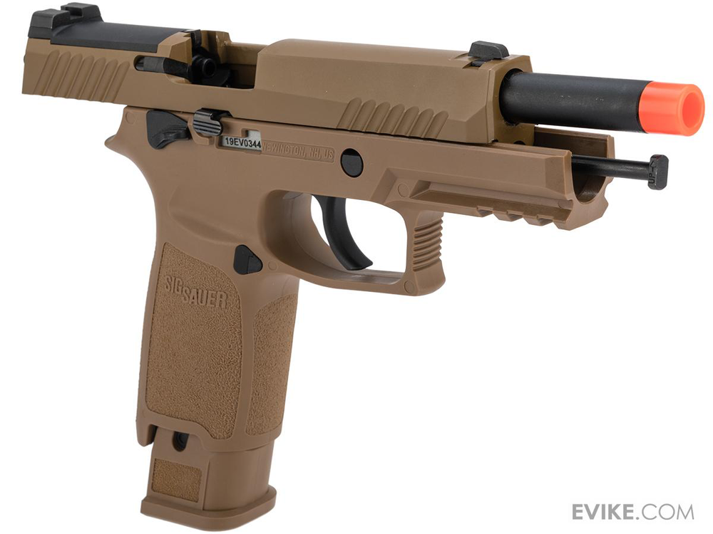 Tan-colored airsoft gun with a red tip on a white background