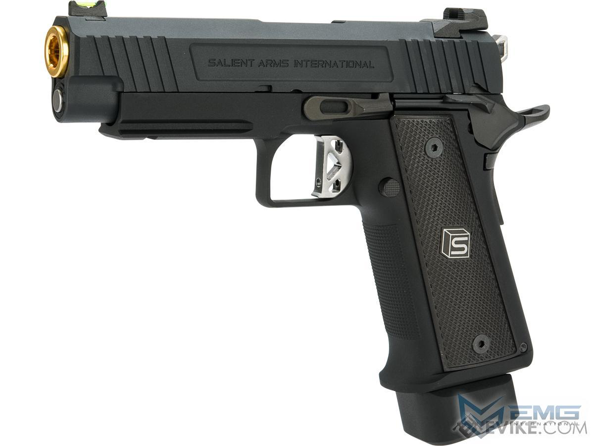 Black handgun with gold accents on a white background