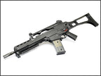 Umarex VFC G36KV V2 airsoft rifle angled top-left view with carry handle rail, transparent magazine and stock.