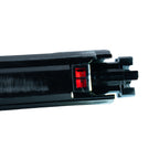 Close-up of a black metal component with a red light on a white background