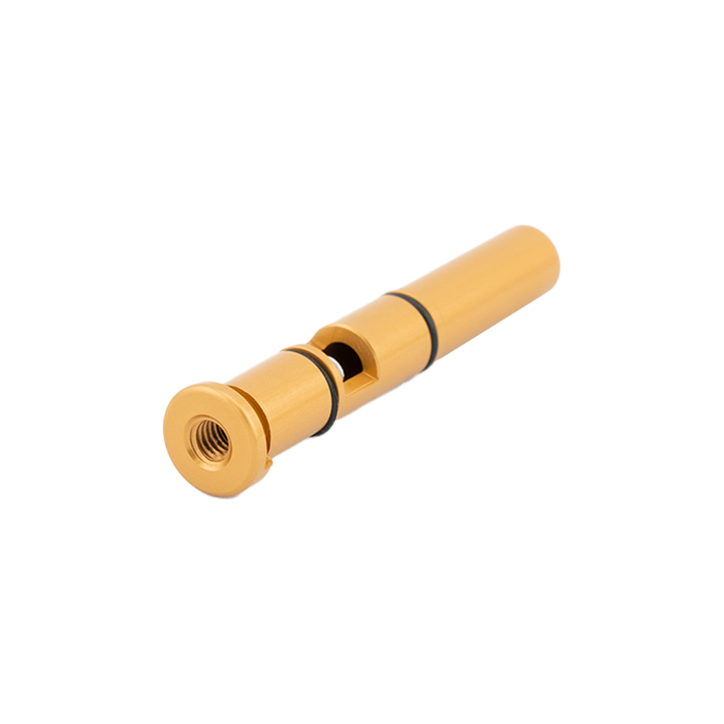 Gold-colored metal fitting on a white background