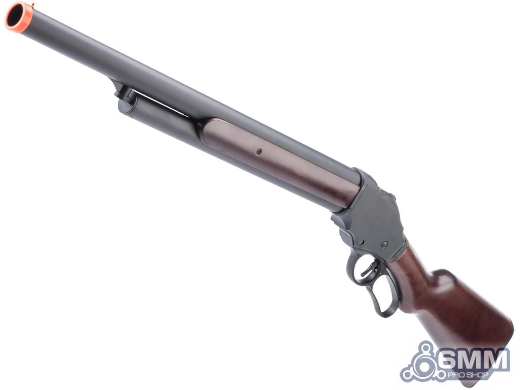A replica or airsoft rifle with a dark gray metallic barrel and receiver, a brown wooden stock, and an orange tip, shown against a plain white background.
