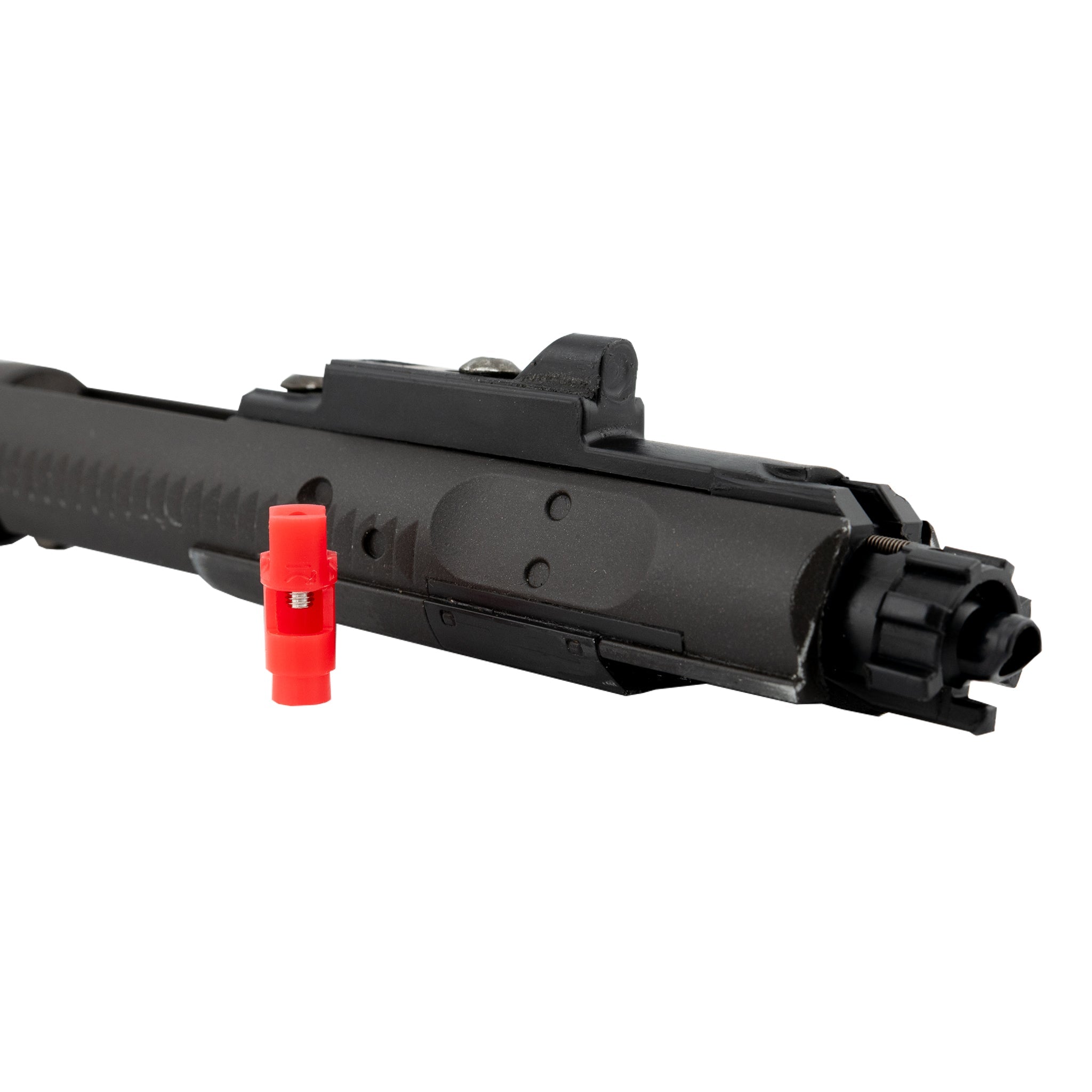 Black gun bolt with red component on a white background