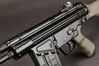 A close-up shot of a black tactical submachine gun with a tan/grey grip and stock, set against a dark grey background.