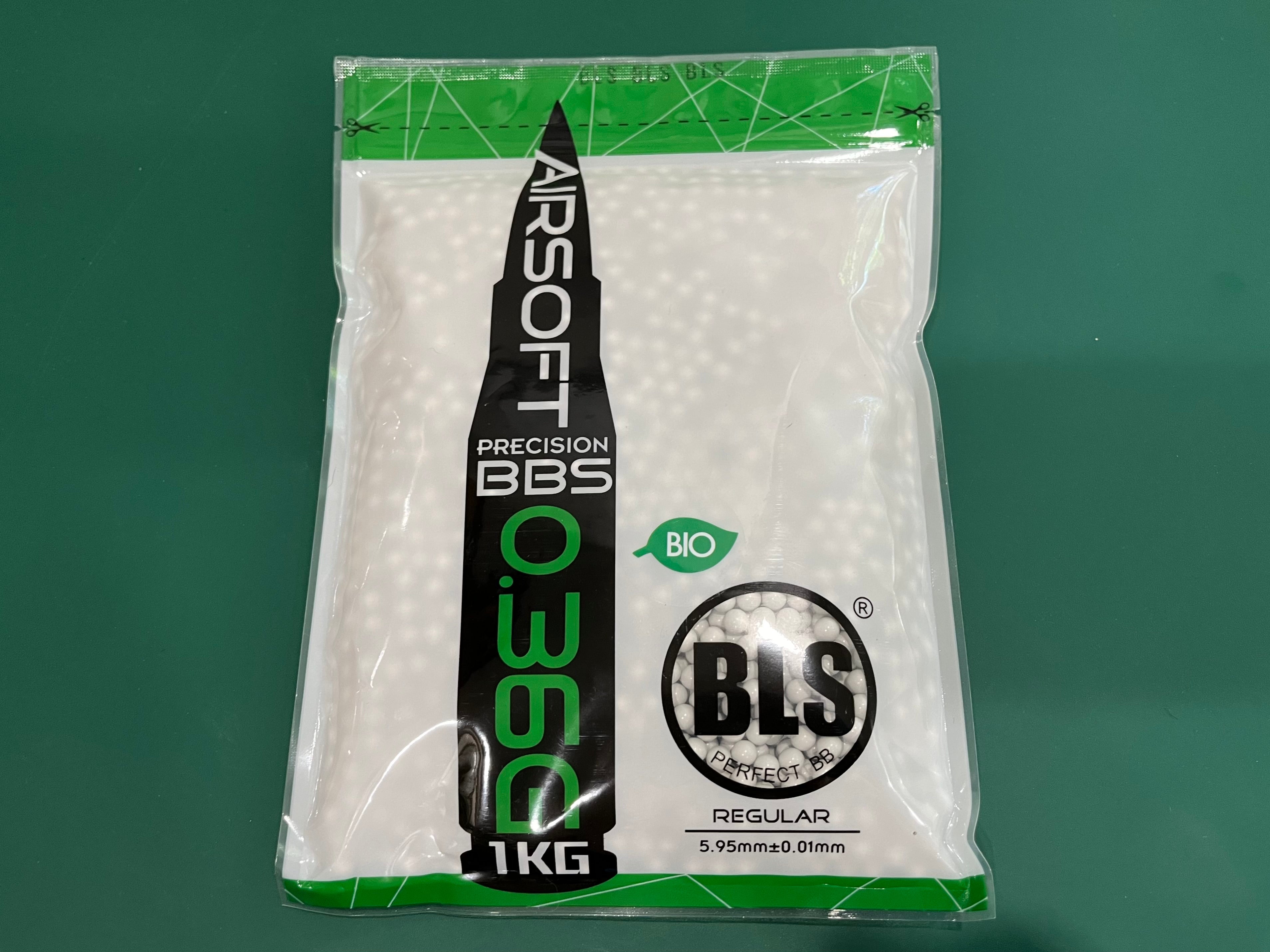 Packaged airsoft BBs with BLS branding on a green background