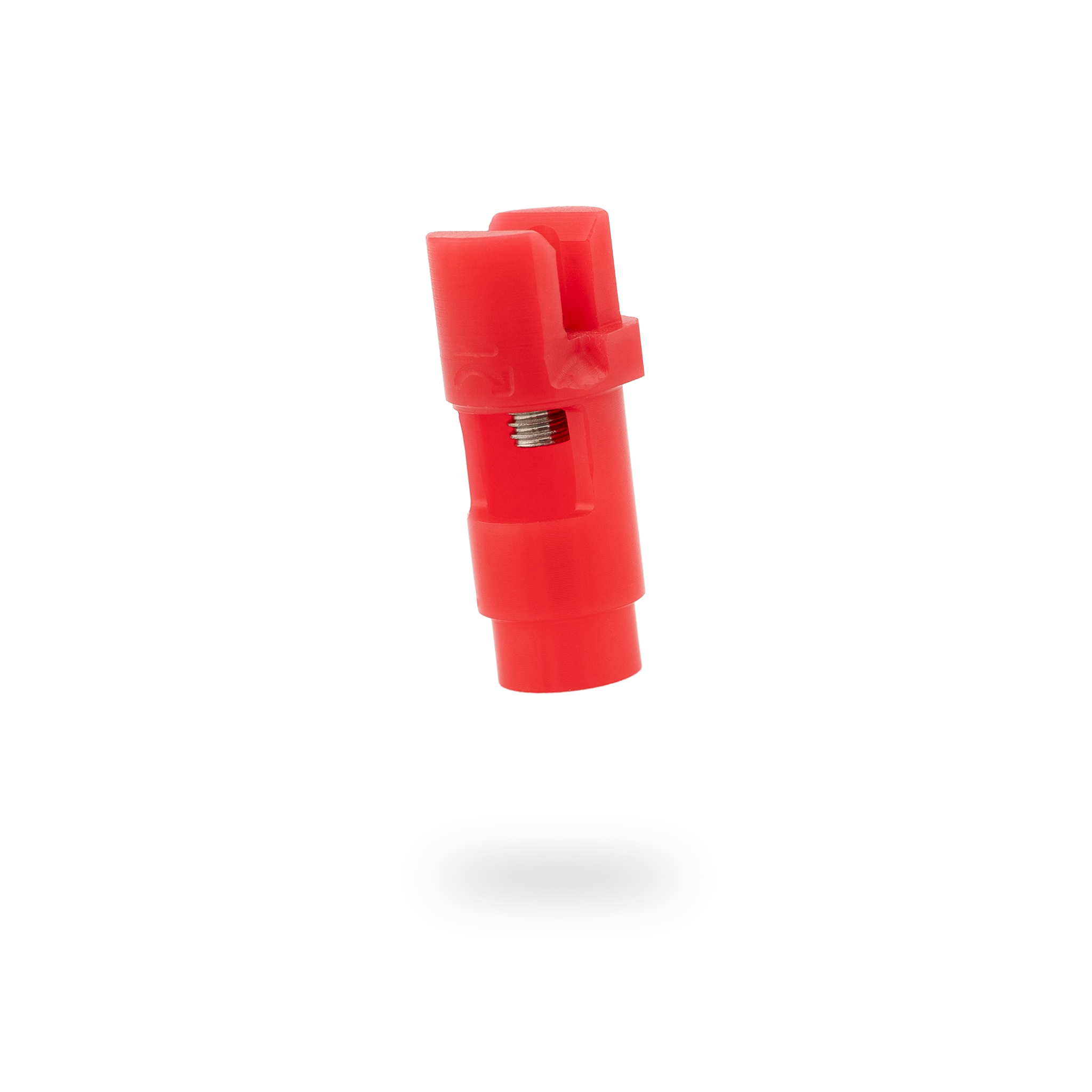 Red plastic connector on a white background