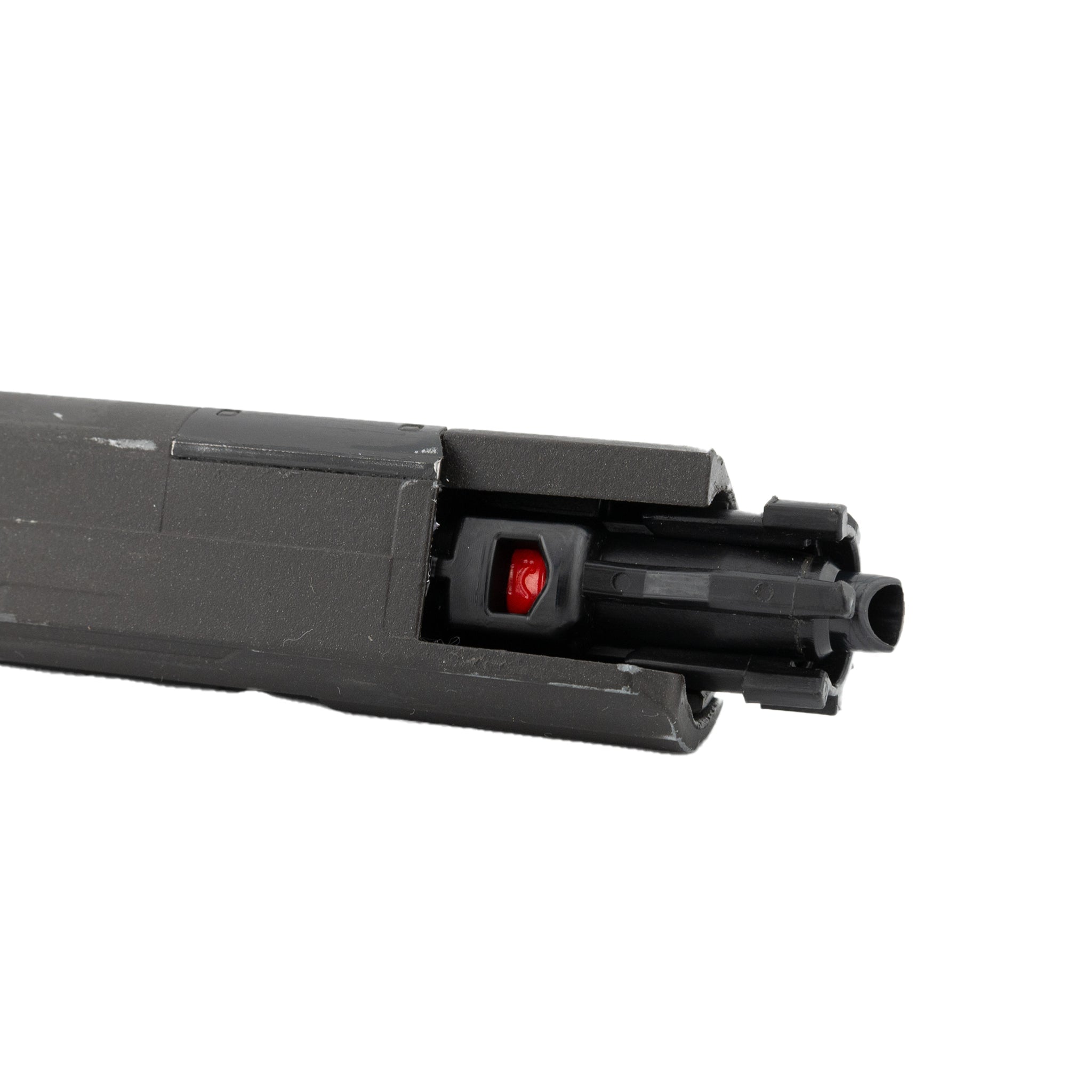 Black gun bolt with red dot on a white background