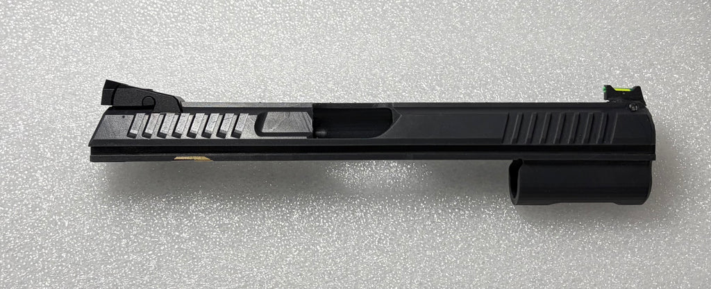 Black gun slide on a gray textured background