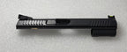 Black gun slide on a gray textured background