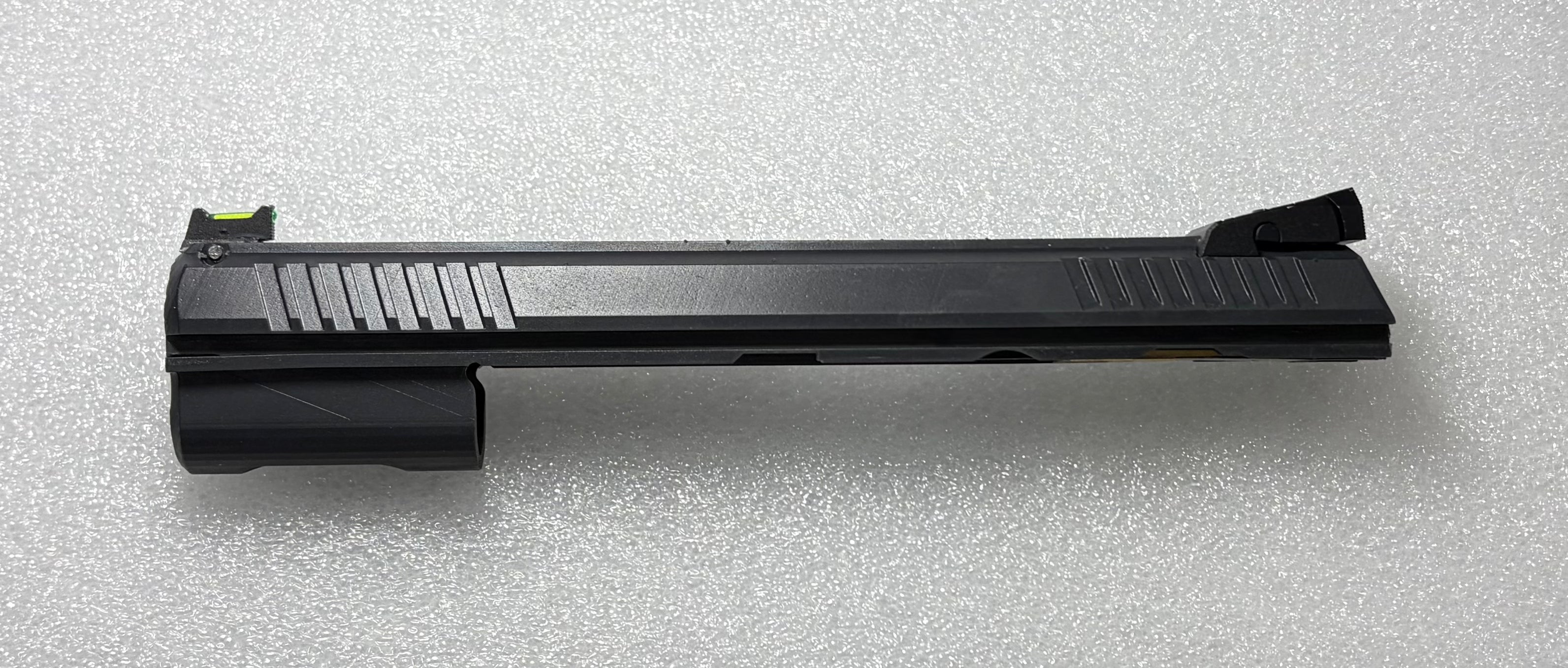 Black pistol slide on a white background