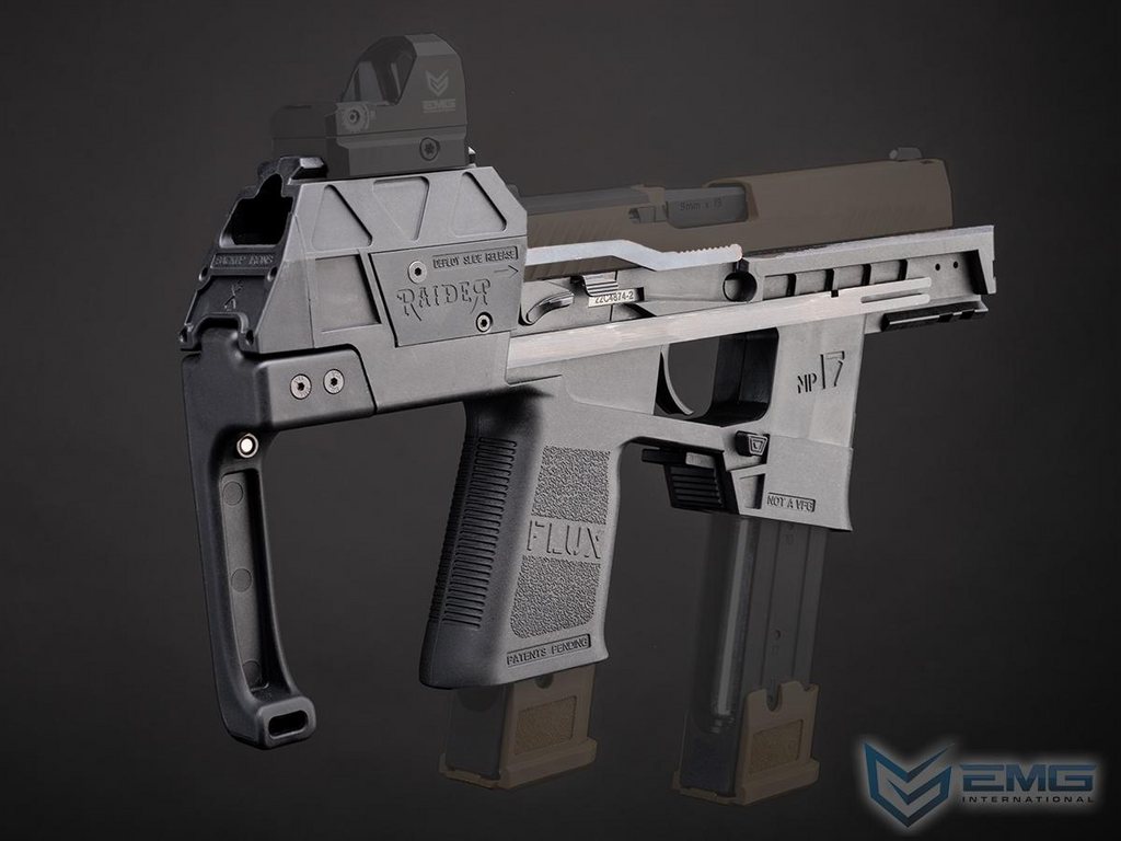 A tactical submachine gun replica or airsoft pistol in matte gray and black, featuring a vertical foregrip, adjustable stock, and two attached magazines, shown against a dark gray studio background.