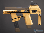 A Flux submachine gun replica or airsoft model shown in side profile against a dark gray studio background. The firearm features a tan and black color scheme with 'FLUX' branding embossed on the grip and receiver.