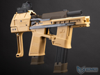 A tactical replica submachine gun toy or airsoft rifle in tan and dark brown, shown against a dark gray background. The model features a tan FLUX frame, a black grip, a mounted black optic sight, and a black magazine.