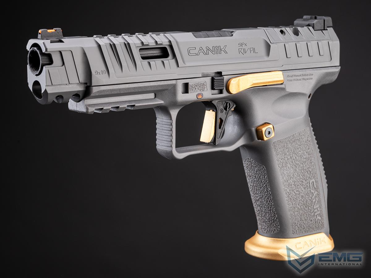 Gray handgun with gold accents on a black background