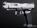 Gray handgun with 'Canik' branding on a black background