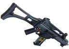 A black tactical-style rifle or airsoft gun with a collapsible stock, vertical foregrip, and attached magazine, shown on a plain white background.