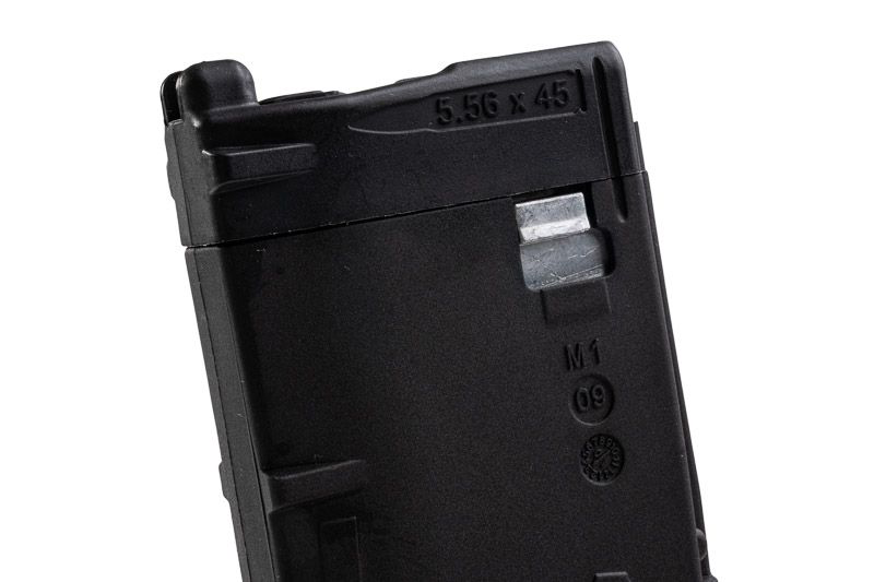 Black VFC VMAG V4 airsoft gas magazine upper side close-up showing silver latch and moulded markings.