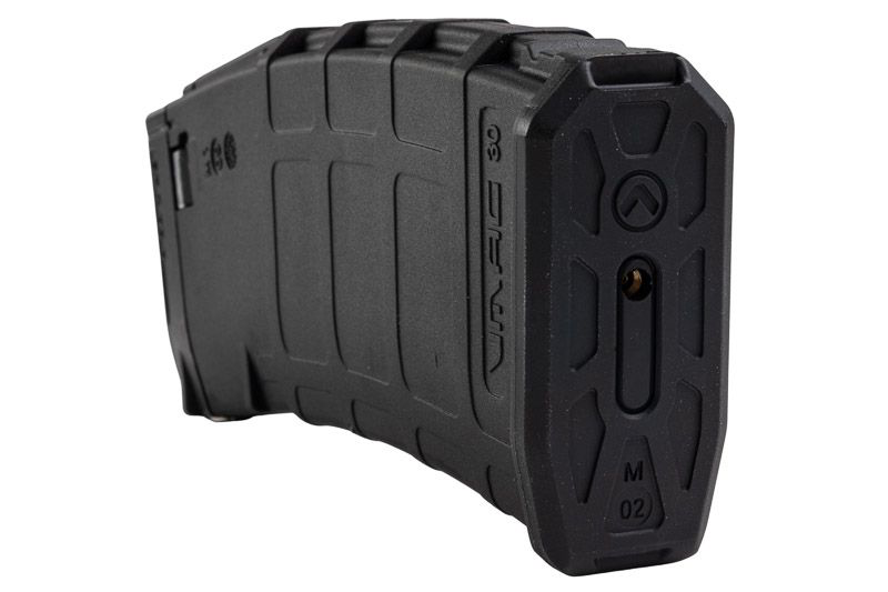Black VFC VMAG V4 airsoft gas magazine angled bottom view showing textured base and brass fill valve.