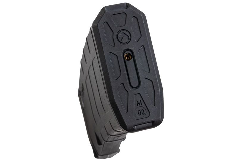Black VFC VMAG V4 airsoft gas magazine base close-up showing brass fill valve and moulded geometric panels.