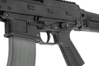 Maruyama/VFC ISO556 airsoft rifle left receiver close-up showing selector, trigger, ribbed grip and magazine.