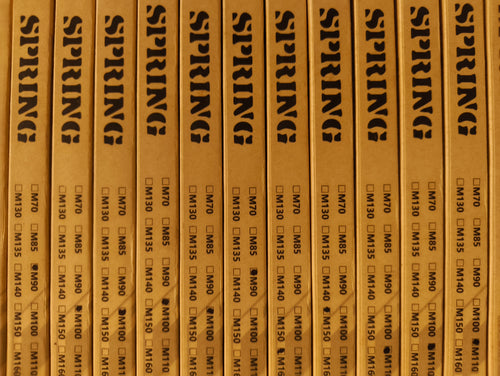 Row of wooden boxes labeled 'SPRING' with text and checkboxes.