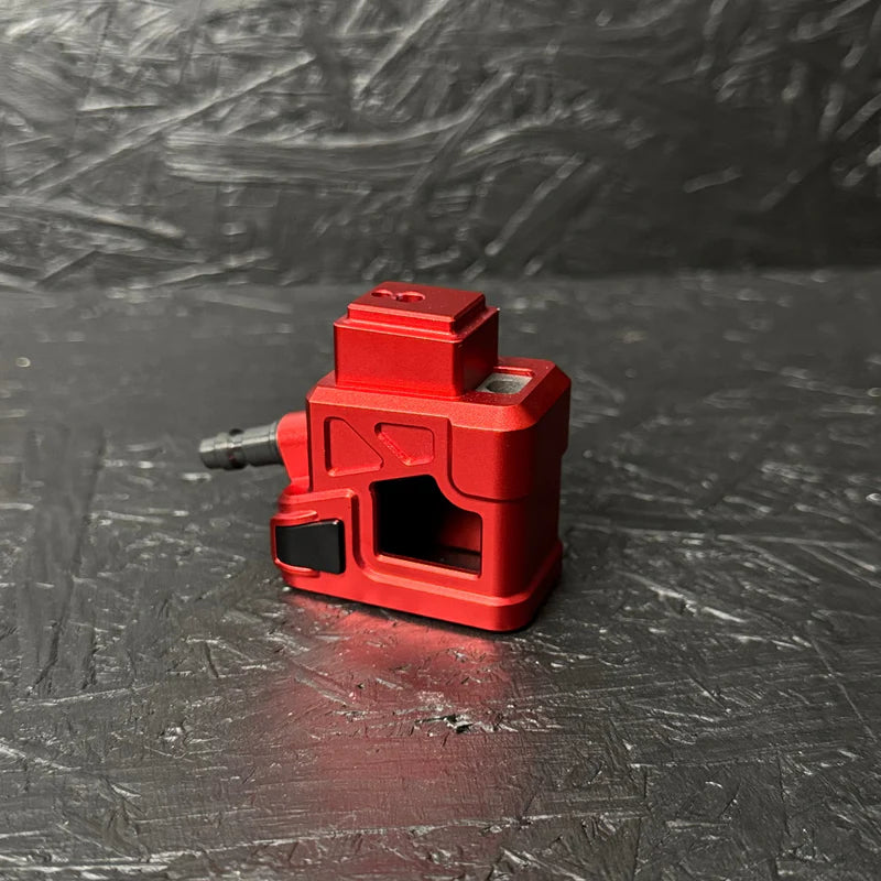 Red tool on a textured black surface
