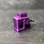 Purple metal component on a gray textured surface