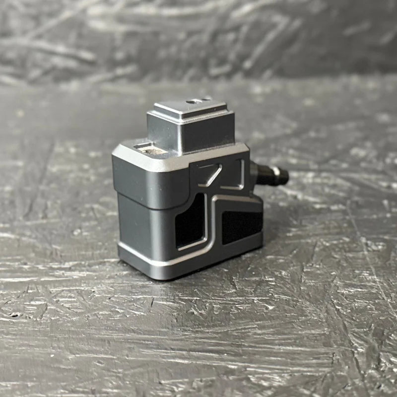 Small mechanical device on a textured gray surface