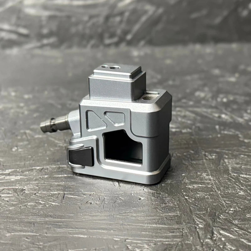 Metallic mechanical component on a textured gray surface