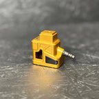 Yellow tool on a metallic surface with a gray background