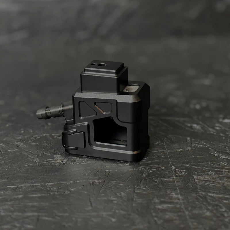 Black mechanical component on a textured black surface