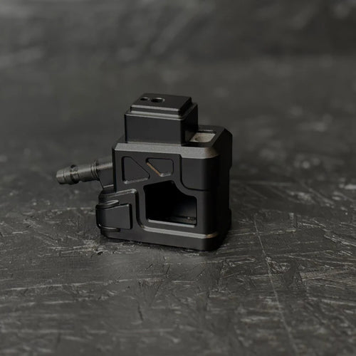 Black mechanical component on a textured black surface