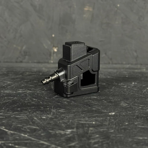 Black mechanical component on a textured black surface