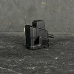 Black mechanical component on a textured black surface
