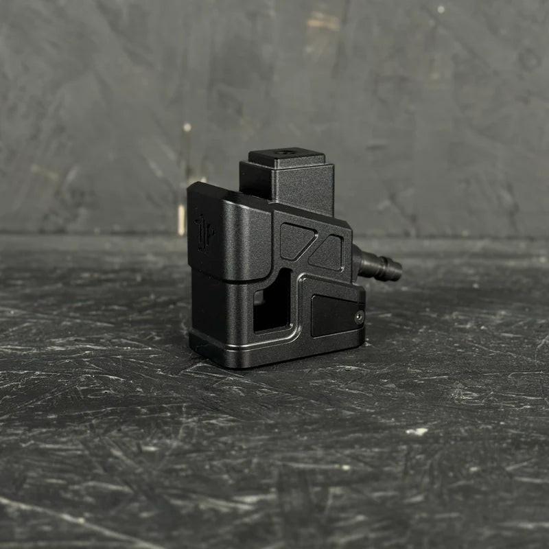Black mechanical component on a textured black surface