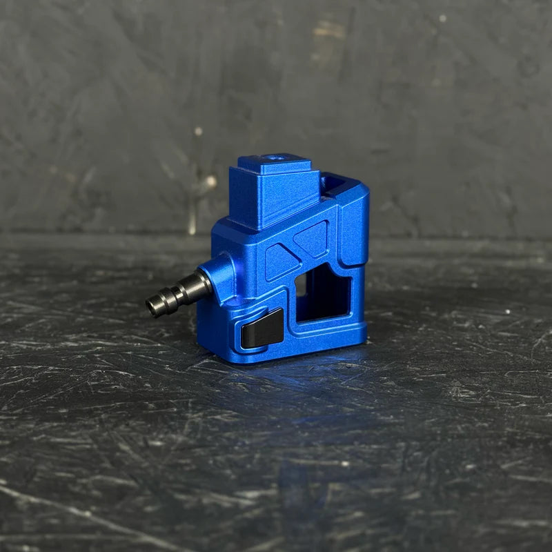 Blue mechanical component on a dark textured surface