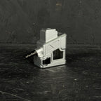 Metallic device with a plug on a dark textured surface