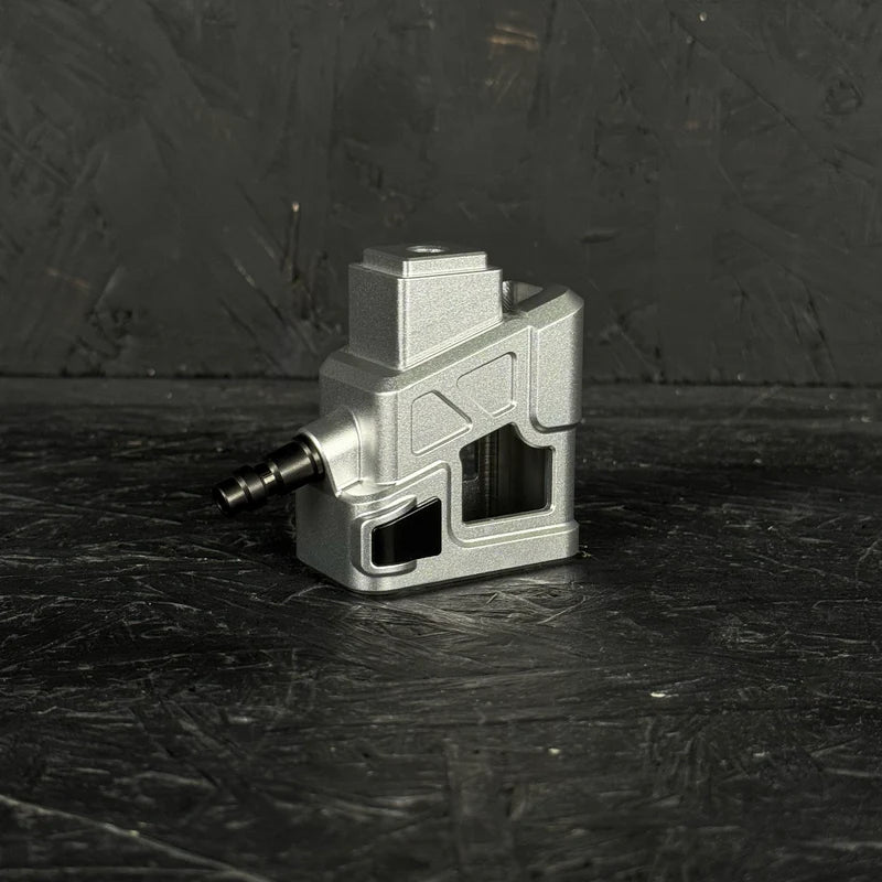 Metallic device with a plug on a dark textured surface