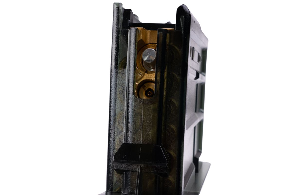 VFC G36KV transparent airsoft gas magazine rear close-up showing brass valve housing and silver release valve.