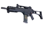 Umarex VFC G36KV V2 airsoft rifle angled front-left view with carry handle, transparent magazine and extended stock.