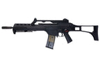 Left profile of Umarex VFC G36KV V2 airsoft rifle with carry handle, vented handguard and transparent magazine.