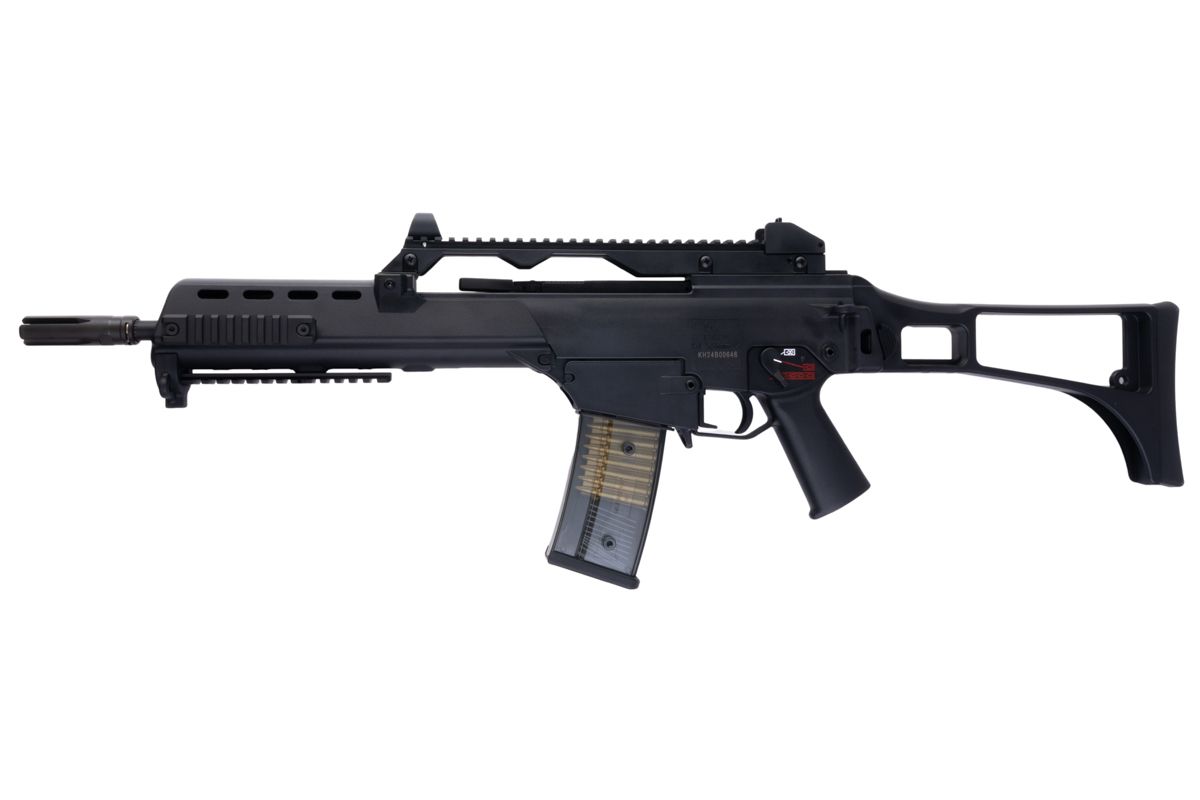 Left profile of Umarex VFC G36KV V2 airsoft rifle with carry handle, vented handguard and transparent magazine.