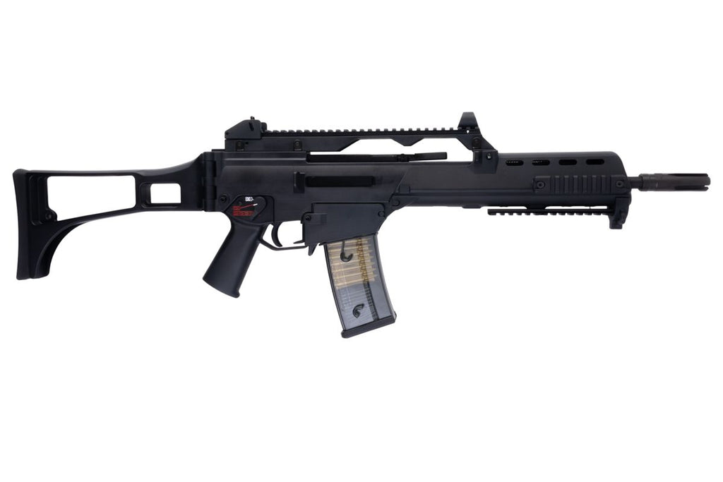 Right profile of Umarex VFC G36KV V2 airsoft rifle with carry handle, extended stock and transparent magazine.