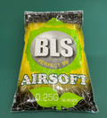 Bag of BLS airsoft BBs on a green background