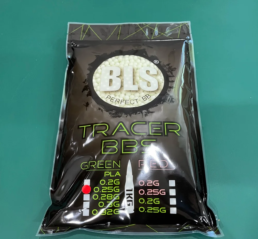 Packaging of BLS tracer BBs with visible branding on a green background