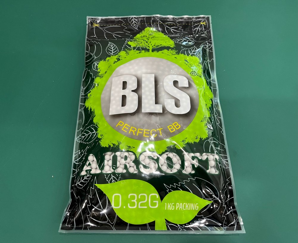 BLS Airsoft BB packaging on a green background