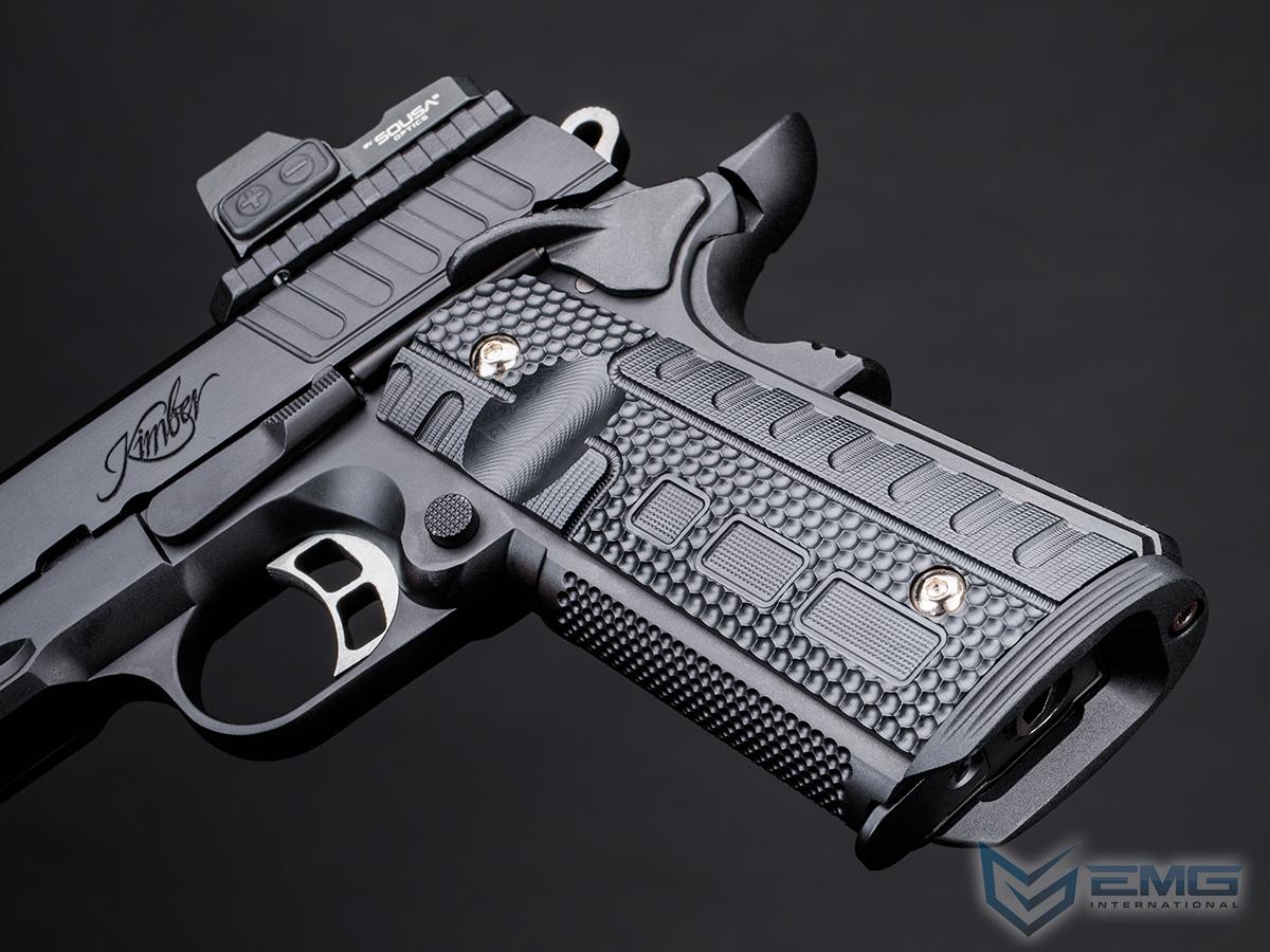 Black handgun with textured grip on a dark background