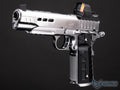 Silver handgun with black grip and red dot sight on a dark background