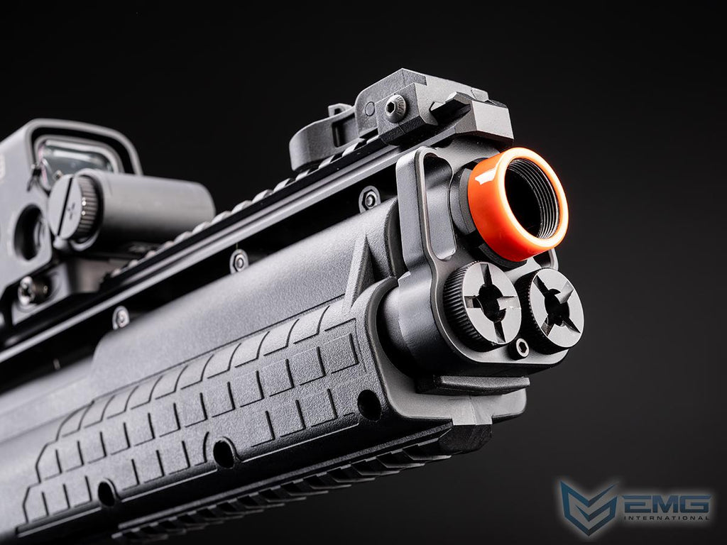 Close-up of a gun with an orange tip on a black background, featuring the EMG logo.