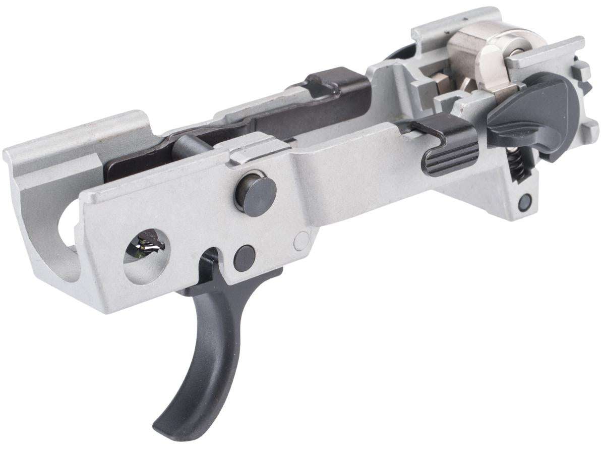 A close-up studio shot of a Sig P320 FCU with a black trigger and black adjustment knobs, isolated on a white background.